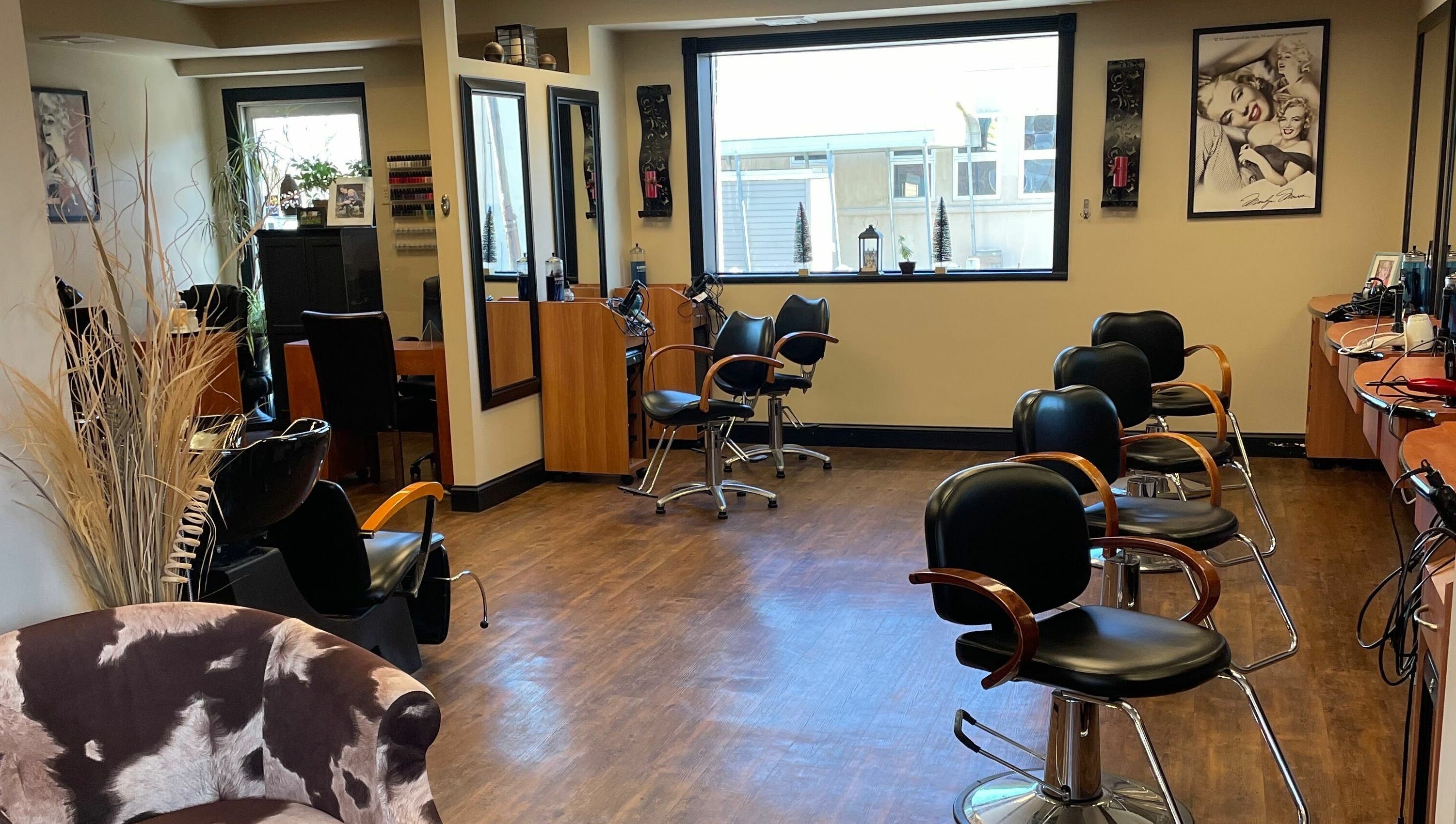 Shear Expression salon interior with stylish chairs and mirrors, Newton, New Jersey, US.