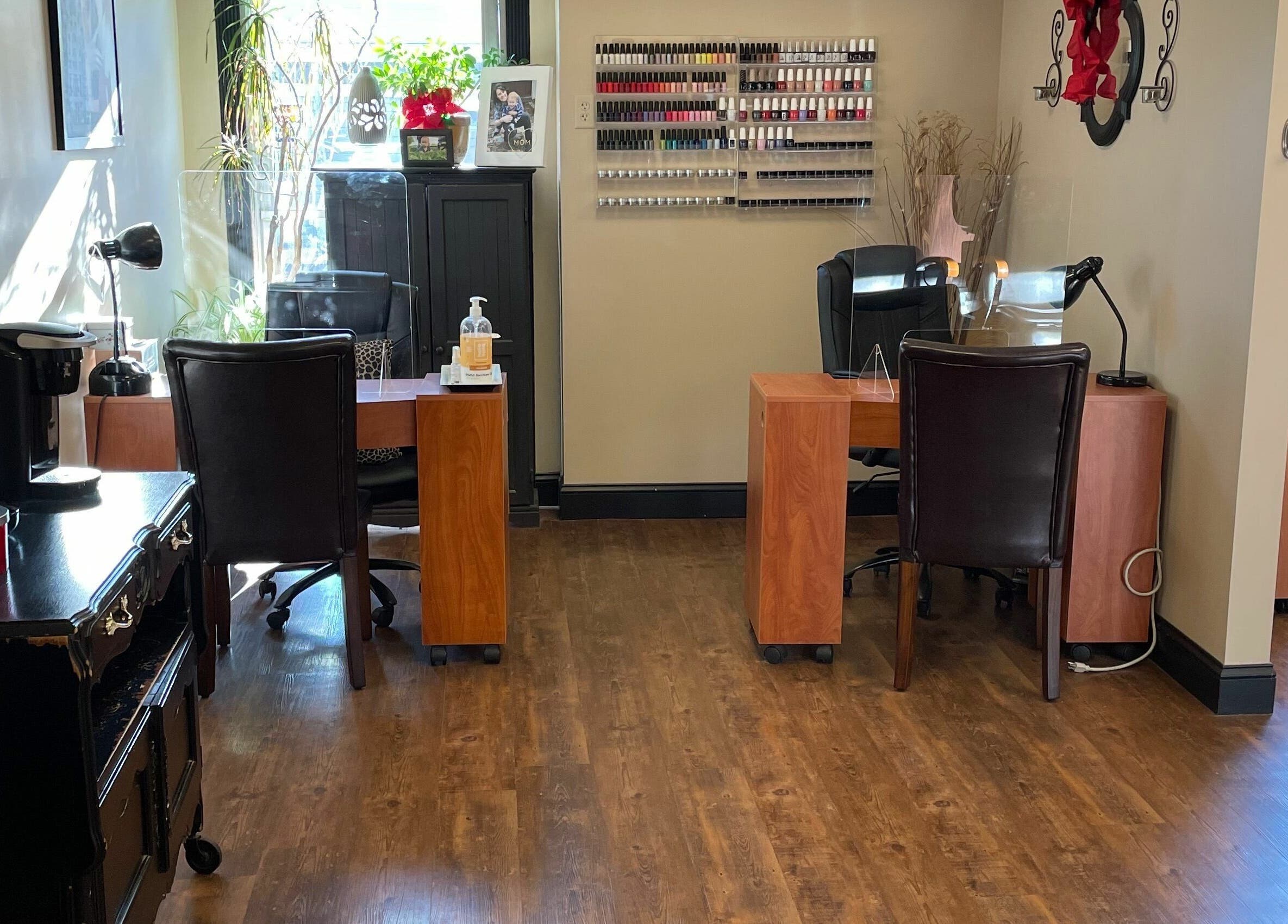 Cozy interior of Shear Expression in Newton, New Jersey, US with nail polish display and seating area.
