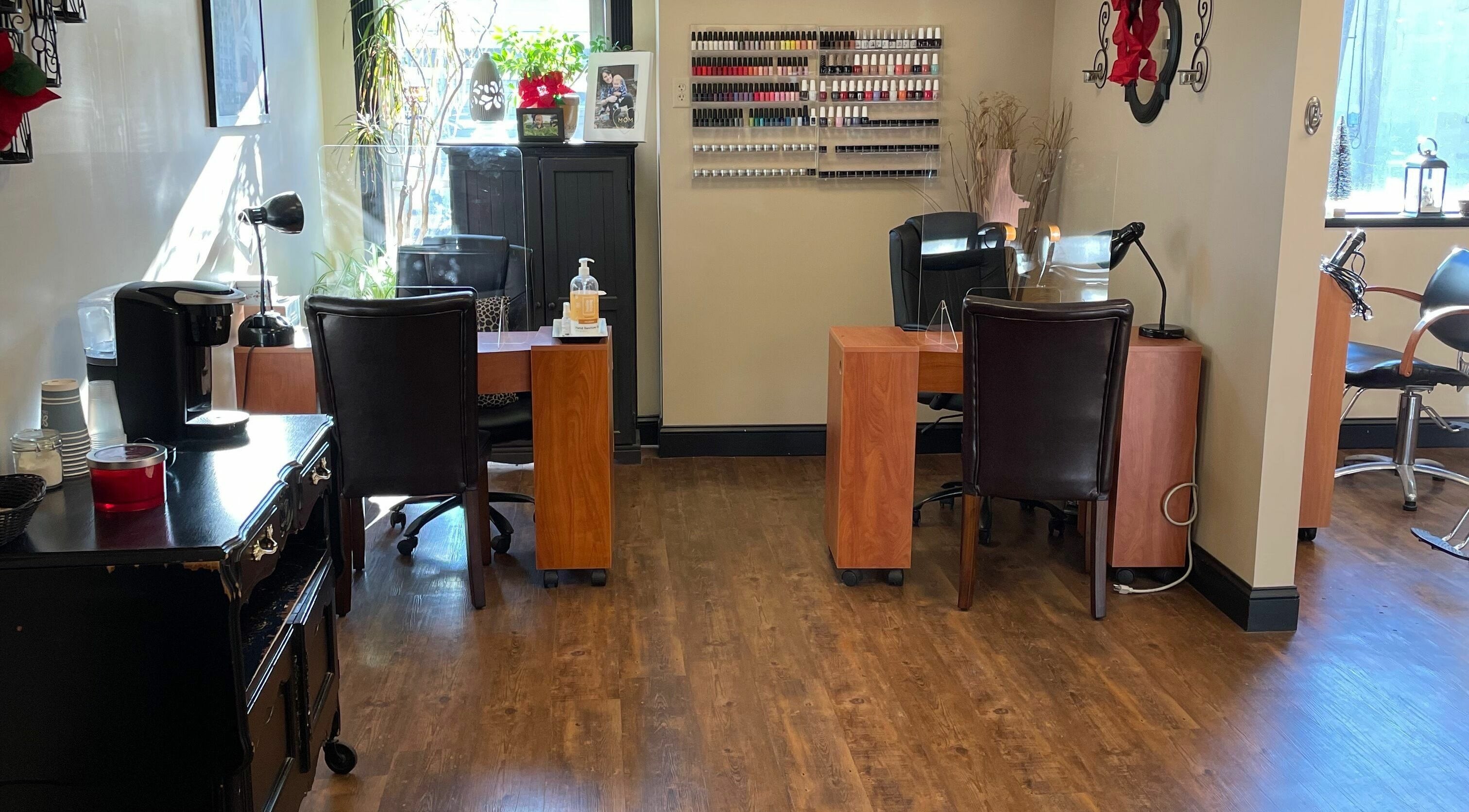 Cozy interior of Shear Expression in Newton, New Jersey, US with nail polish display and seating area.