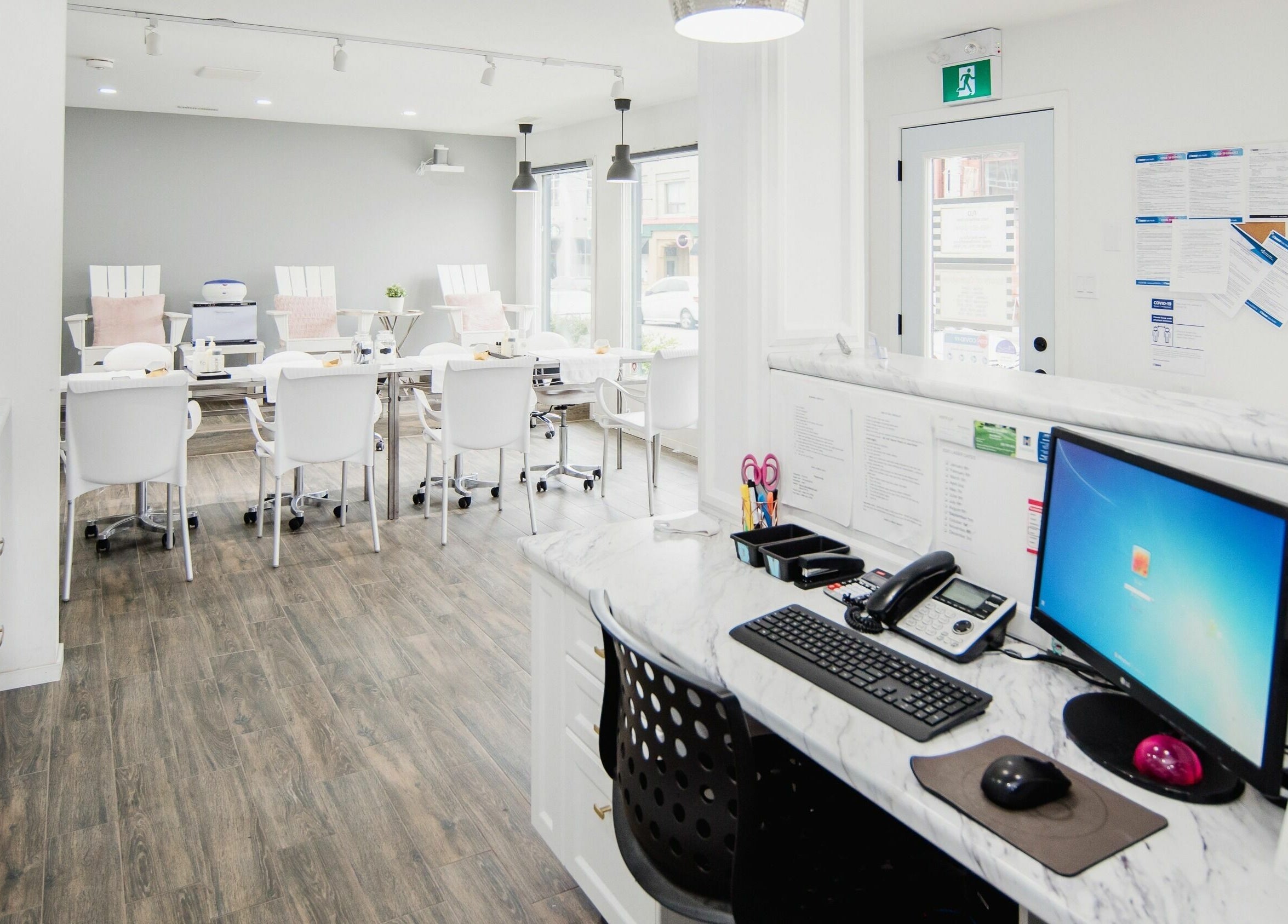 Spacious interior of Flo Aesthetics Nails Laser in Hamilton, Ontario, CA, featuring elegant nail stations.