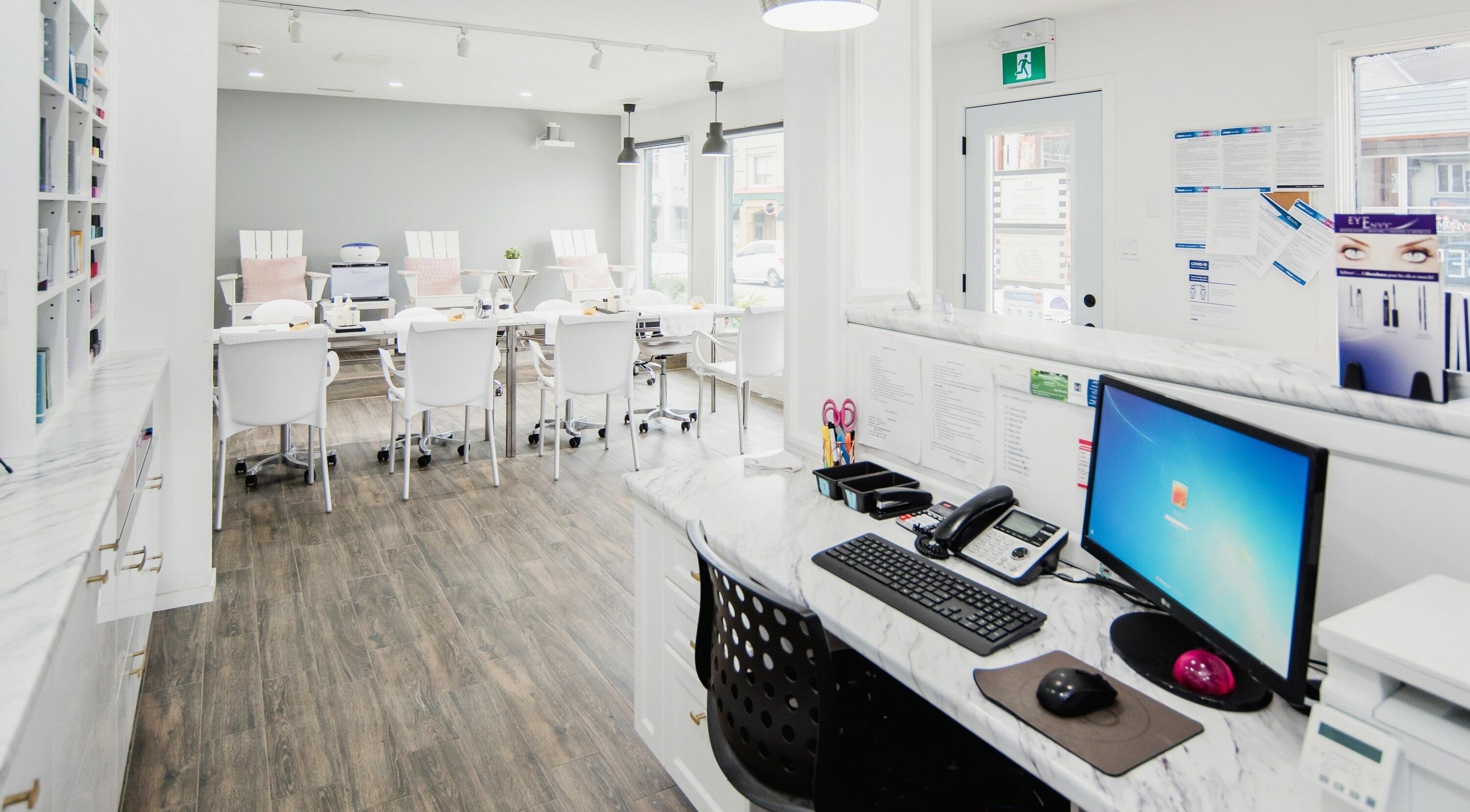 Spacious interior of Flo Aesthetics Nails Laser in Hamilton, Ontario, CA, featuring elegant nail stations.