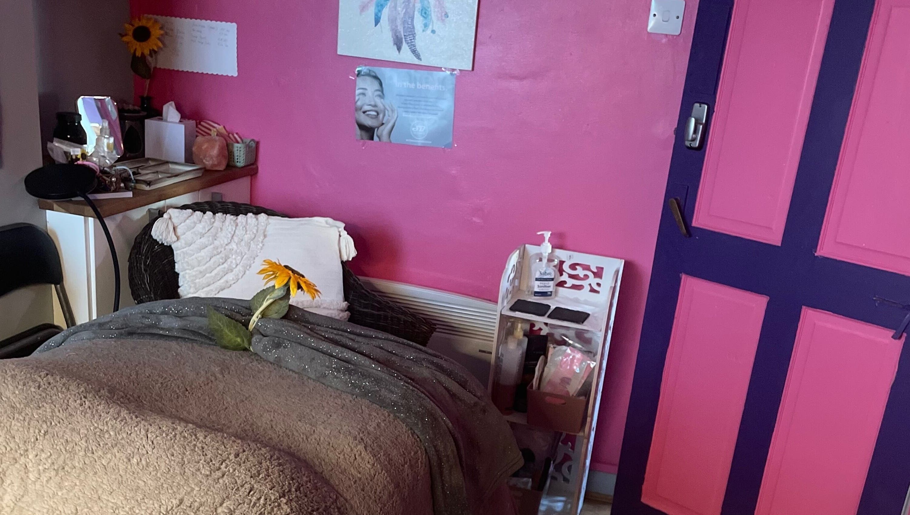 Cozy wellness room at A Little Unorthodox in Allesley Coventry, England, GB with pink decor and sunflower accent.