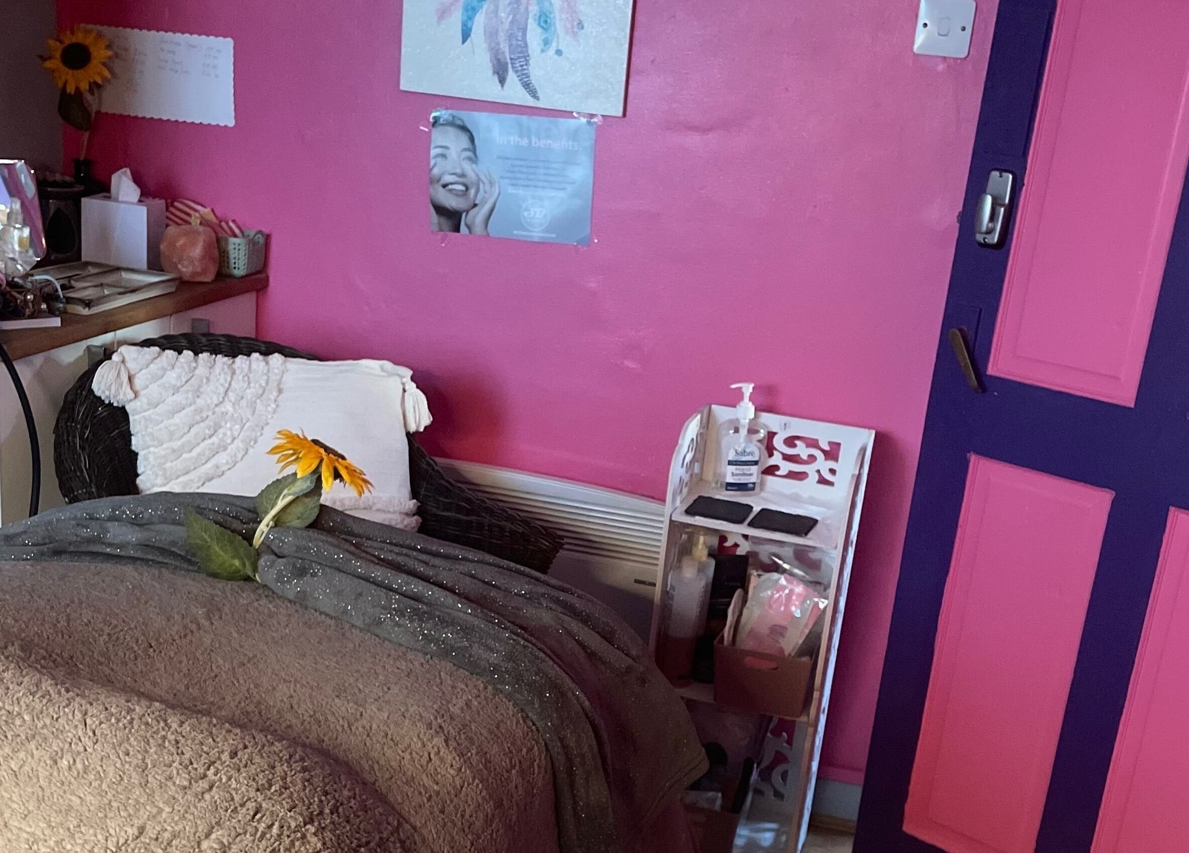 Cozy wellness room at A Little Unorthodox in Allesley Coventry, England, GB with pink decor and sunflower accent.