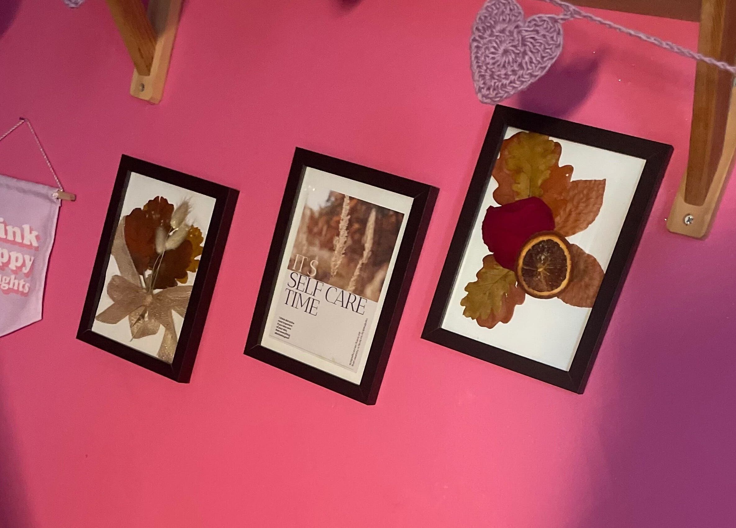Cozy wall decor at A Little Unorthodox, Allesley Coventry, England, GB with framed art and positive message.
