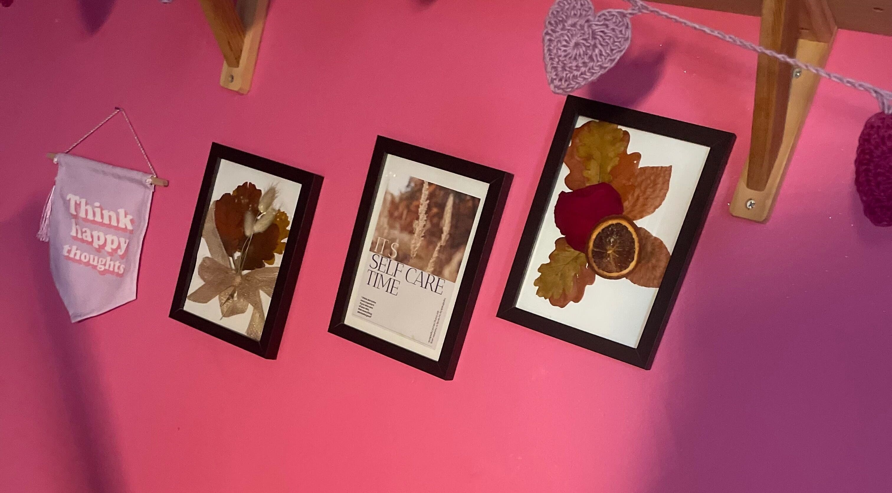 Cozy wall decor at A Little Unorthodox, Allesley Coventry, England, GB with framed art and positive message.