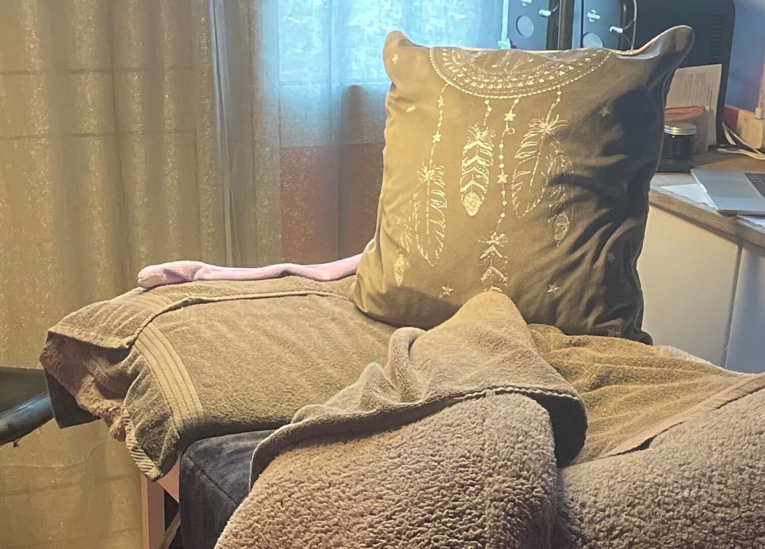 Cozy therapy space at A Little Unorthodox, Allesley Coventry, England, GB with a plush pillow and soft towels.