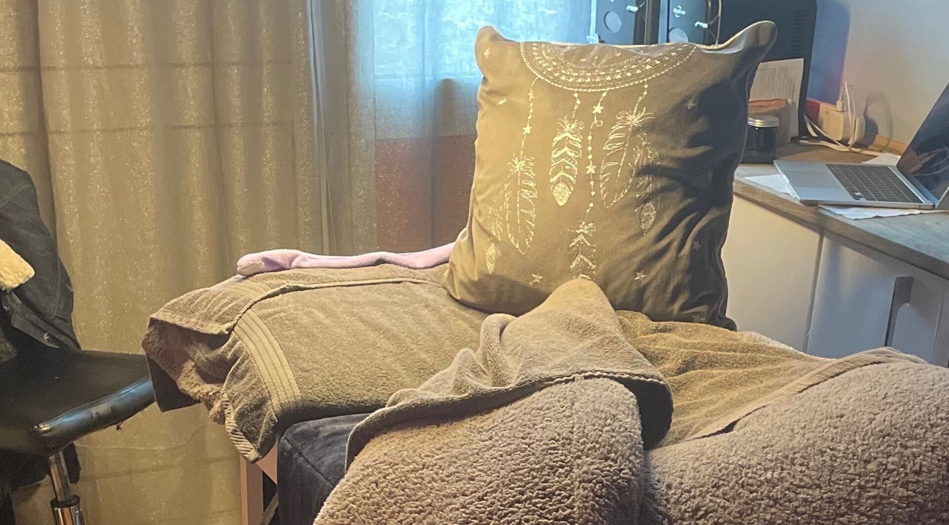 Cozy therapy space at A Little Unorthodox, Allesley Coventry, England, GB with a plush pillow and soft towels.