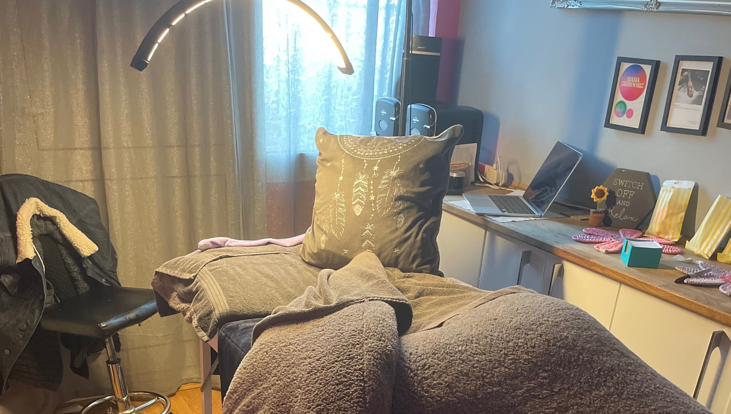 Relaxing treatment room at A Little Unorthodox, Allesley Coventry, England, GB, with soft lighting and cozy decor.