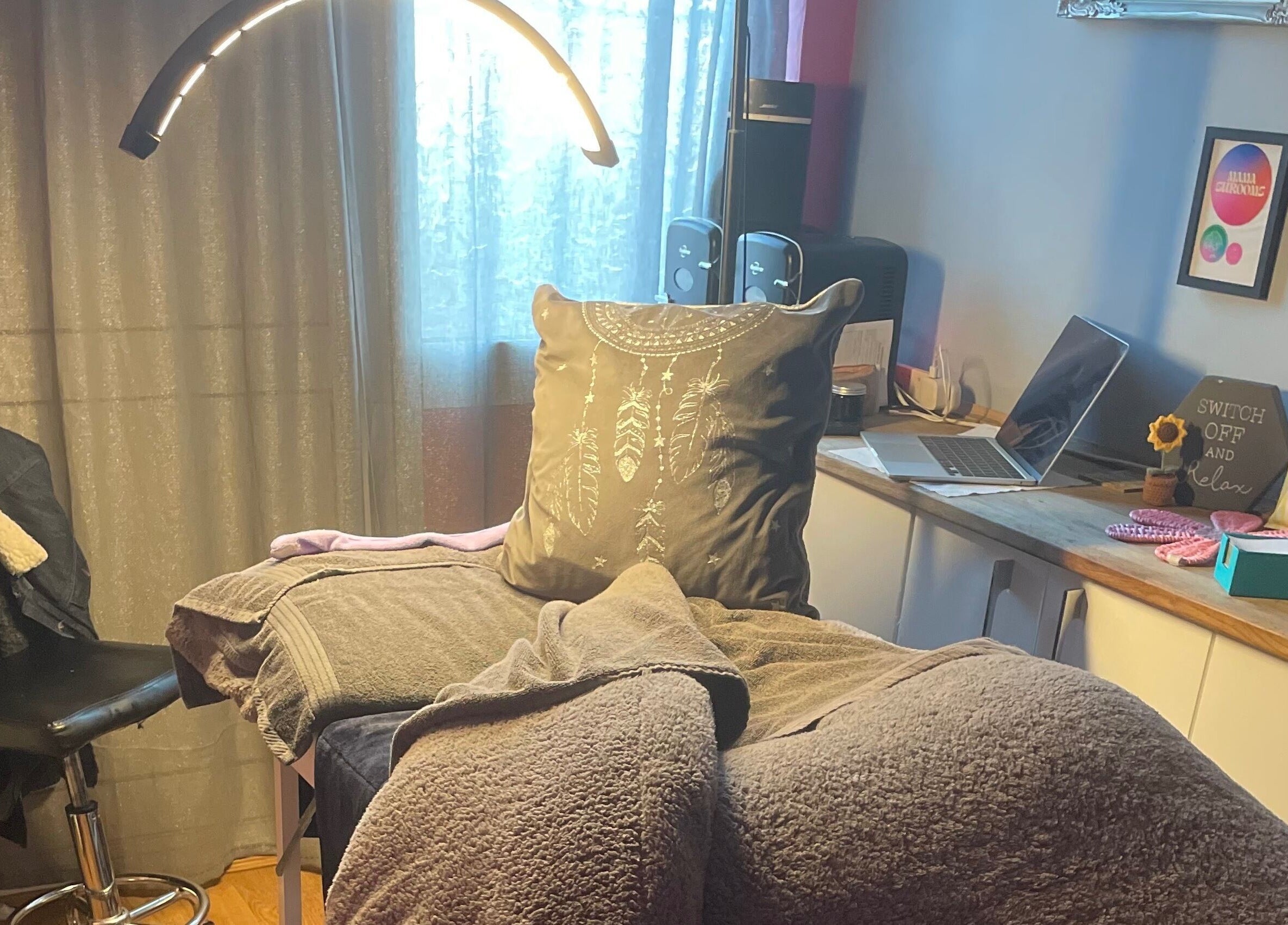 Relaxing treatment room at A Little Unorthodox, Allesley Coventry, England, GB, with soft lighting and cozy decor.