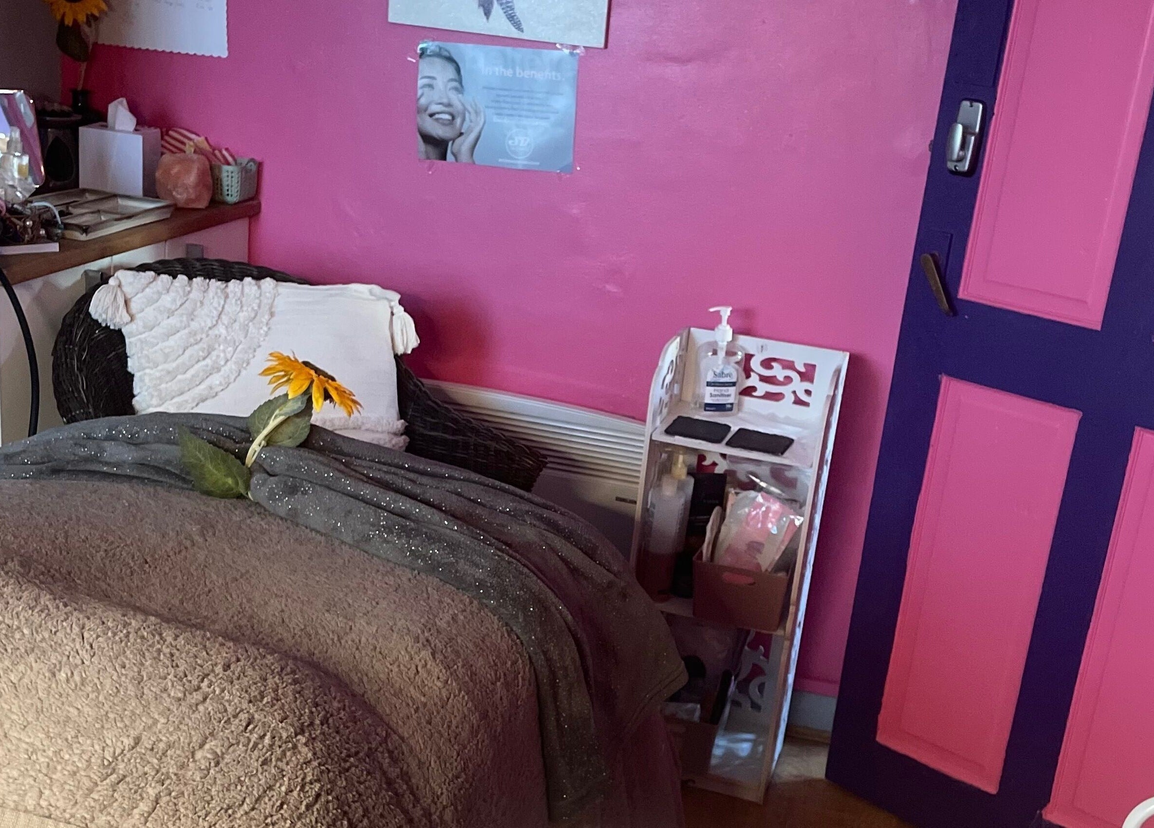 Relaxing beauty corner at A Little Unorthodox, Allesley Coventry, England, GB with pink walls and cozy decor.