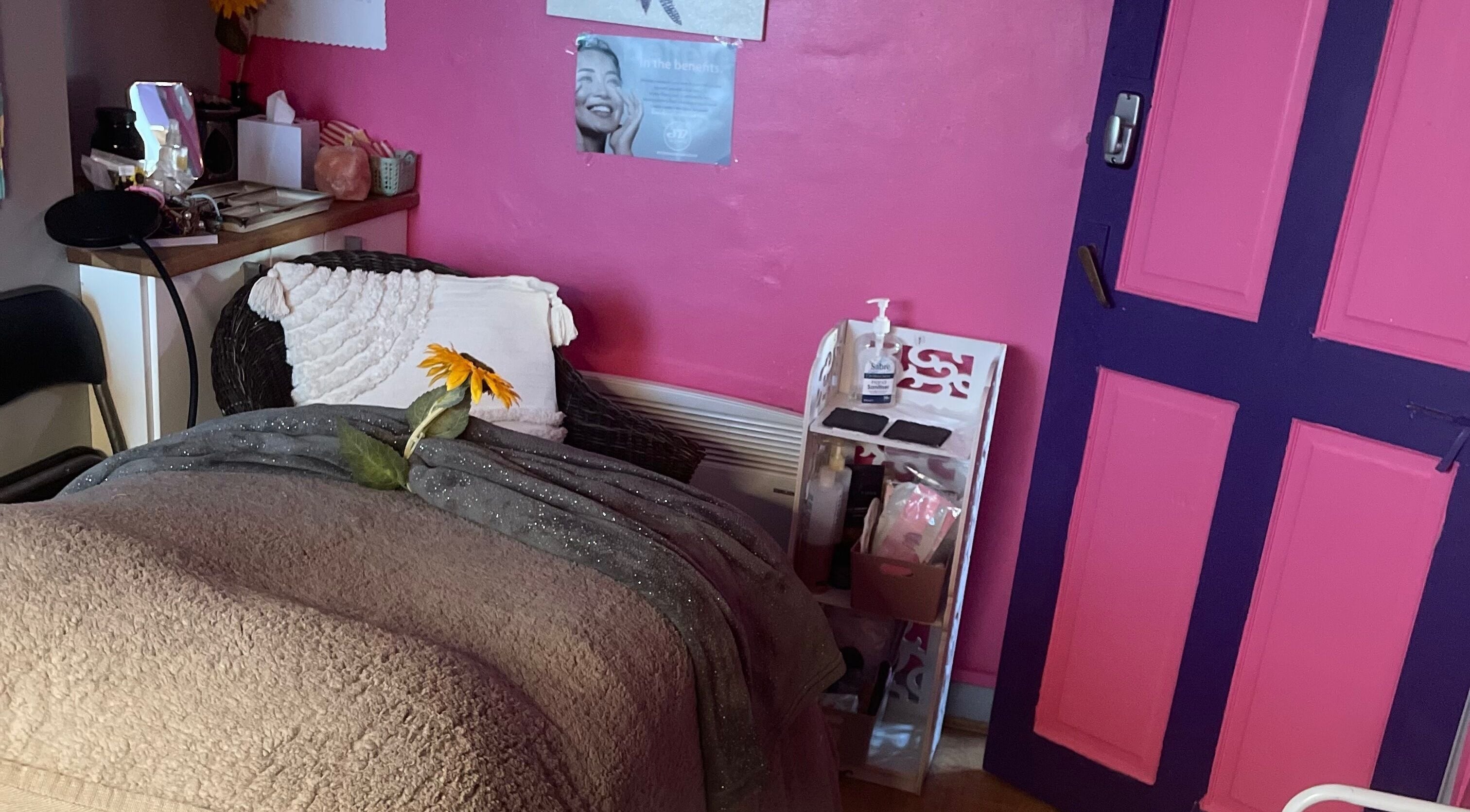 Relaxing beauty corner at A Little Unorthodox, Allesley Coventry, England, GB with pink walls and cozy decor.