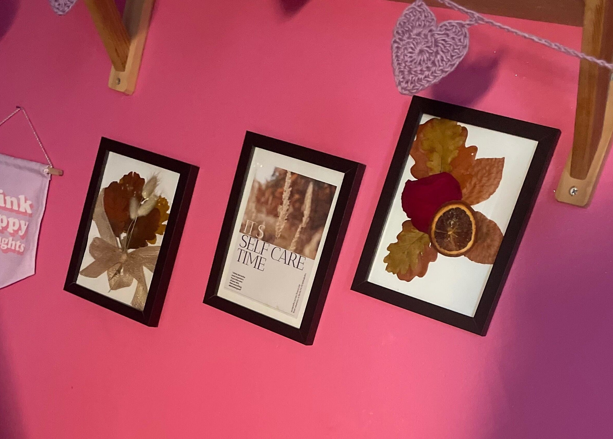 Artistic wall with frames and banner at A Little Unorthodox, Allesley Coventry, England, GB.