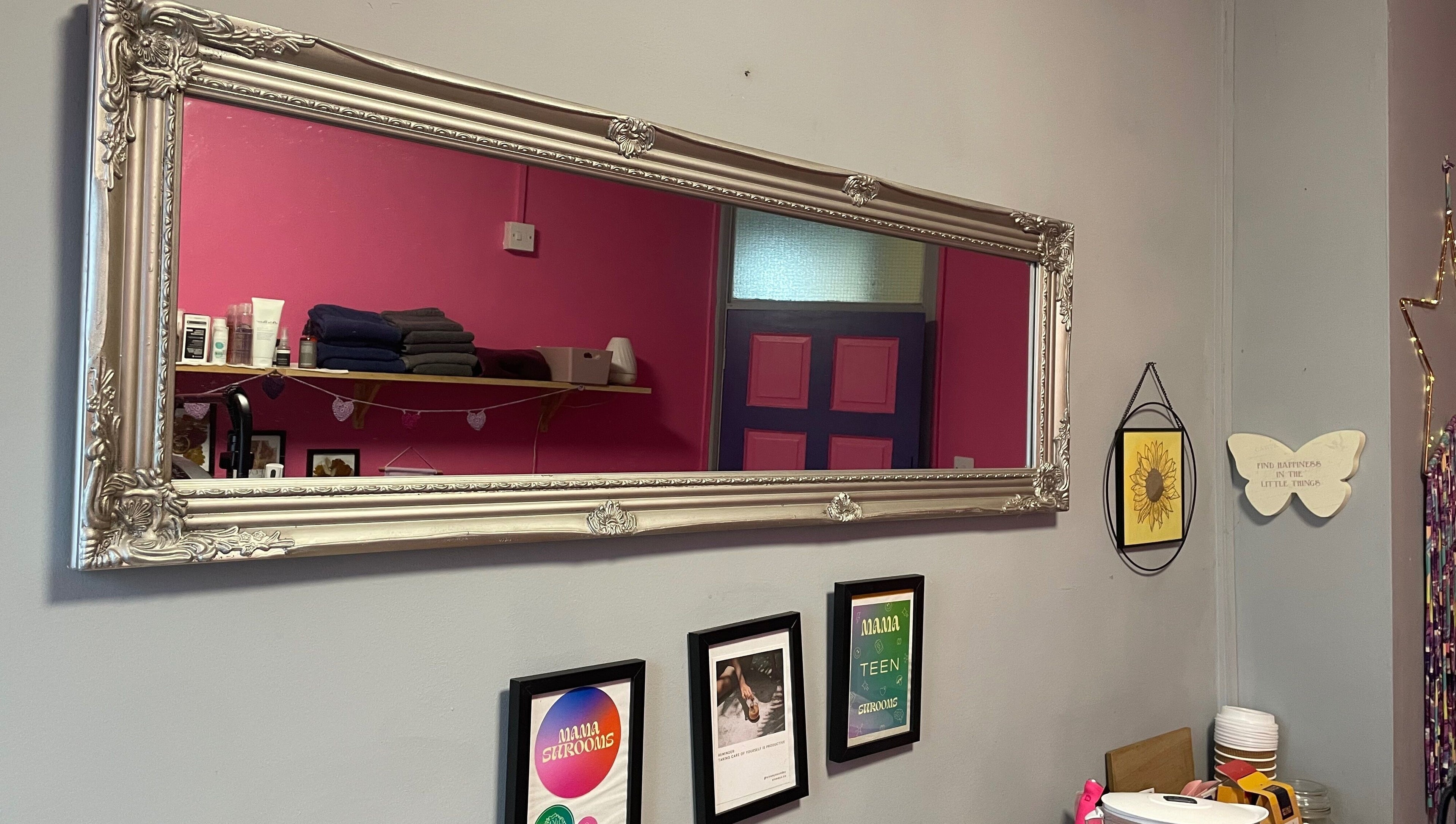 Elegant framed mirror reflecting decor at A Little Unorthodox, Allesley Coventry, England, GB.