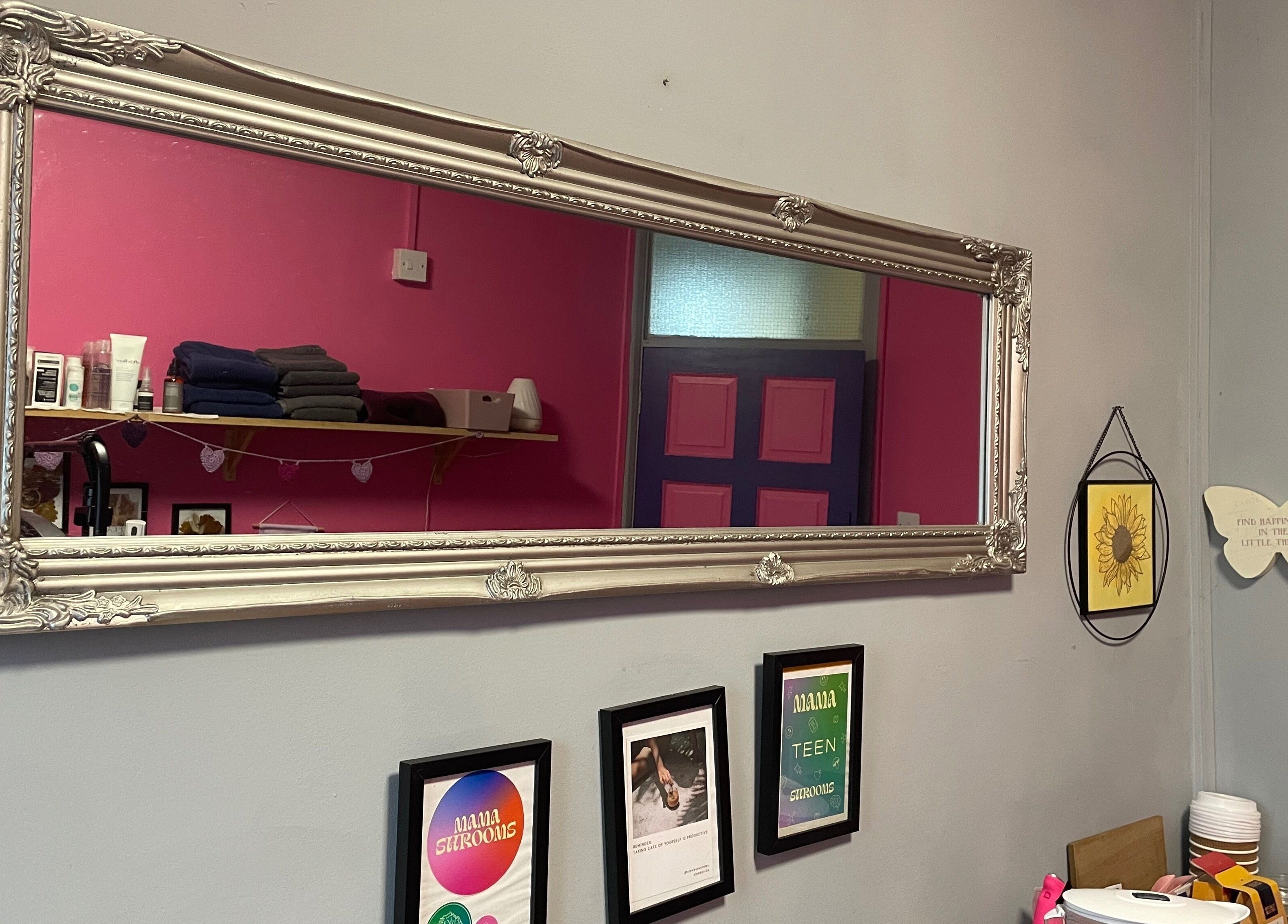 Elegant framed mirror reflecting decor at A Little Unorthodox, Allesley Coventry, England, GB.