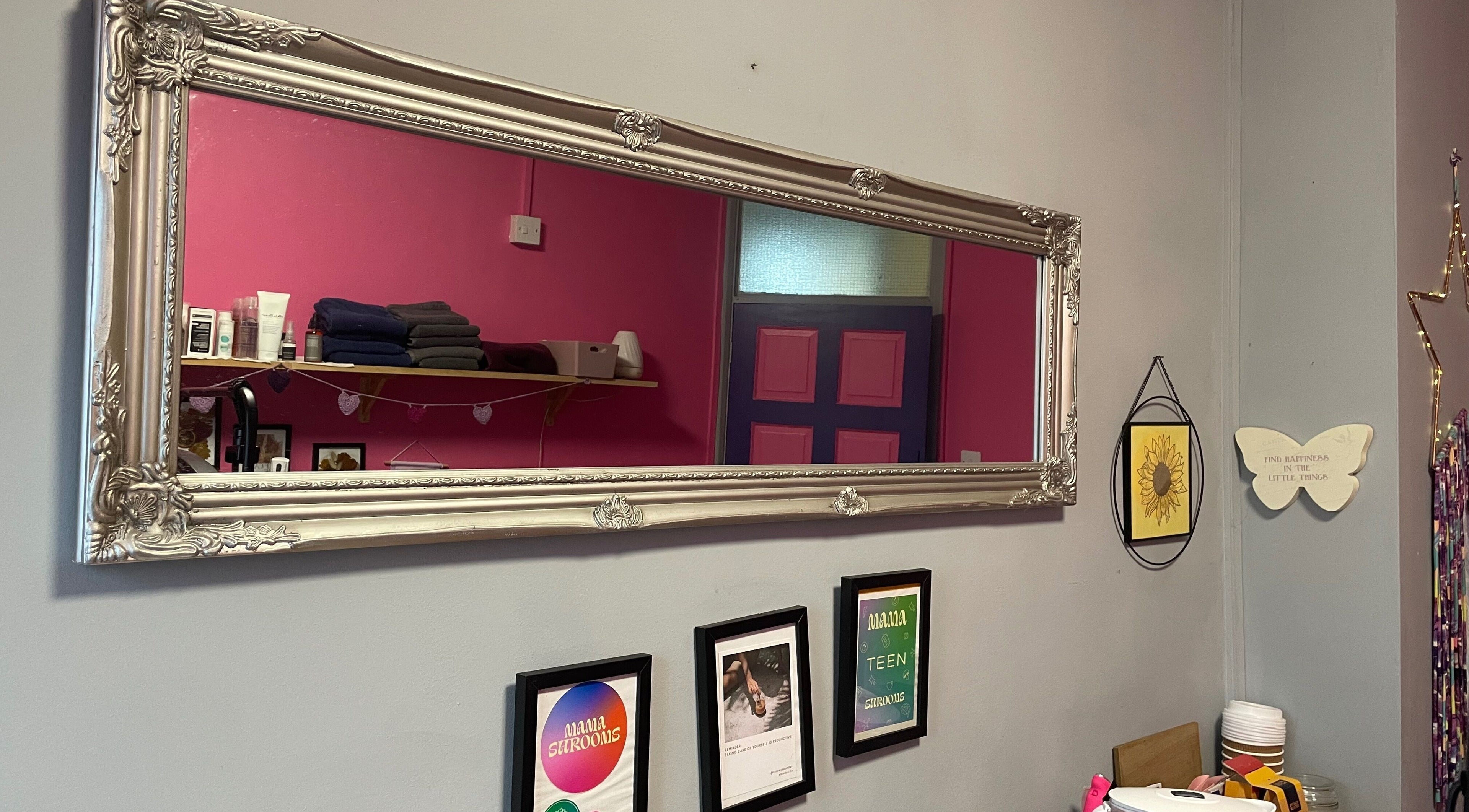 Elegant framed mirror reflecting decor at A Little Unorthodox, Allesley Coventry, England, GB.