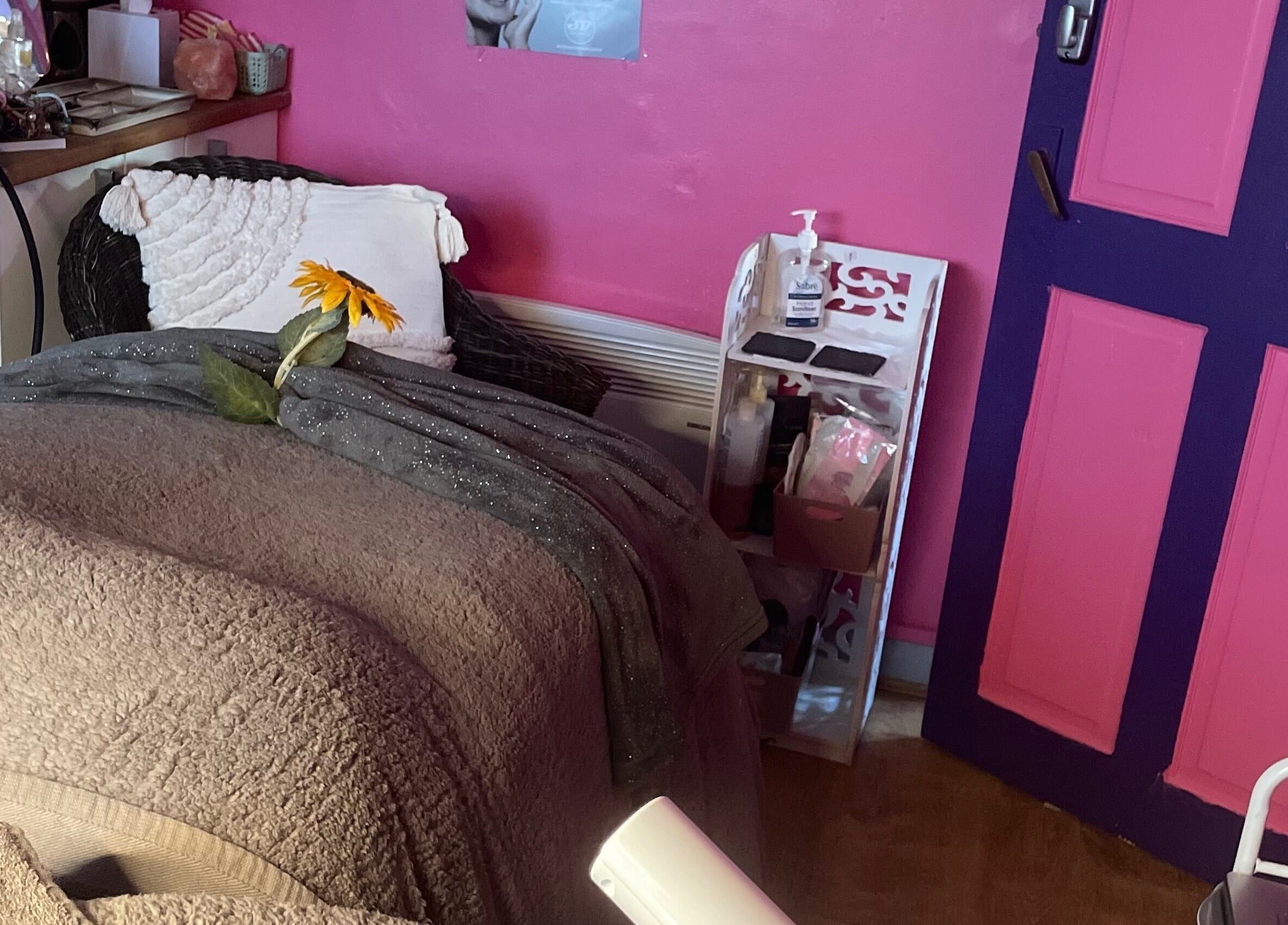 Relaxing therapy room at A Little Unorthodox in Allesley Coventry, England, GB with pink decor.