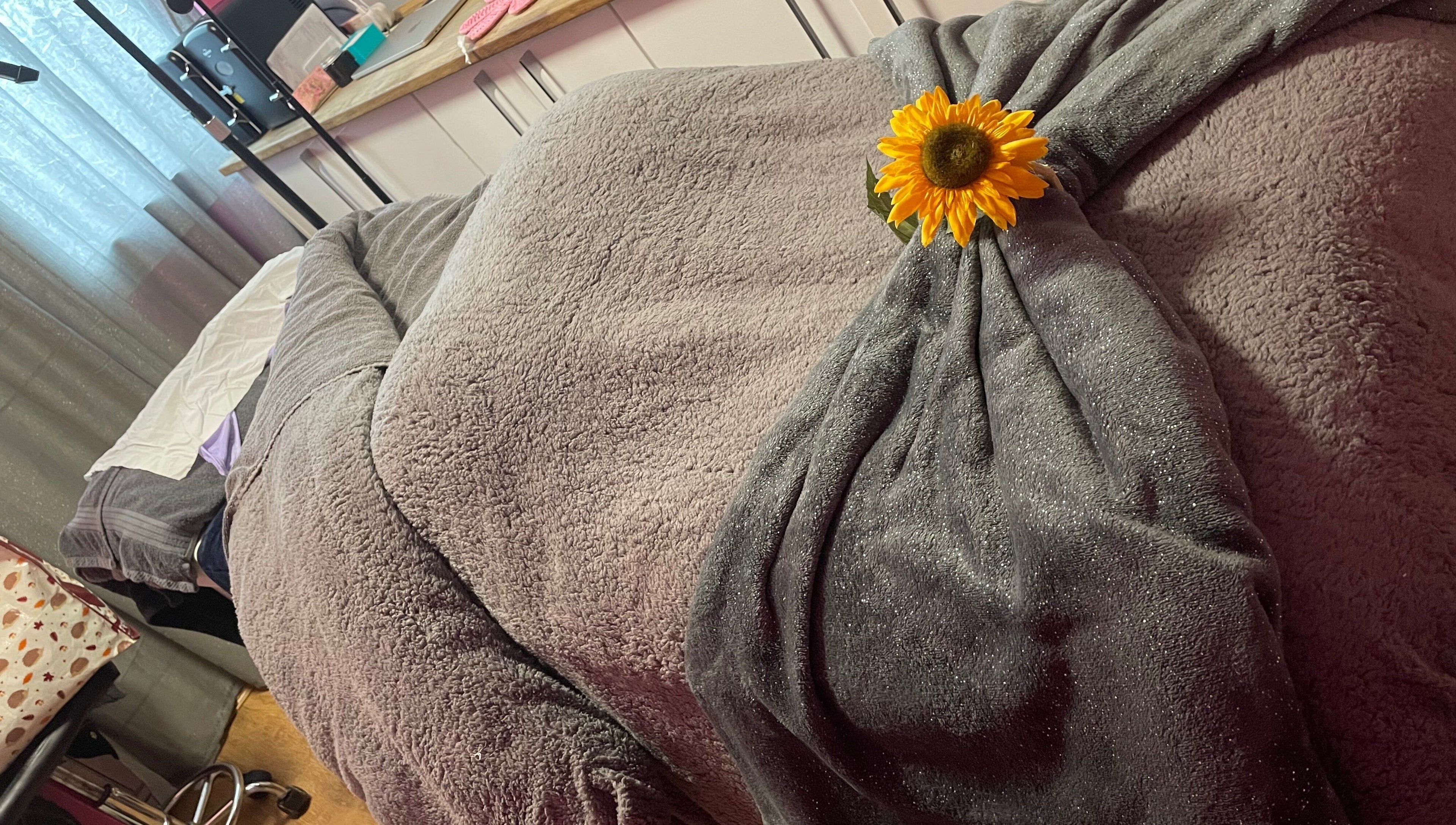 Relaxing massage bed with sunflower accent at A Little Unorthodox, Allesley Coventry, England, GB.