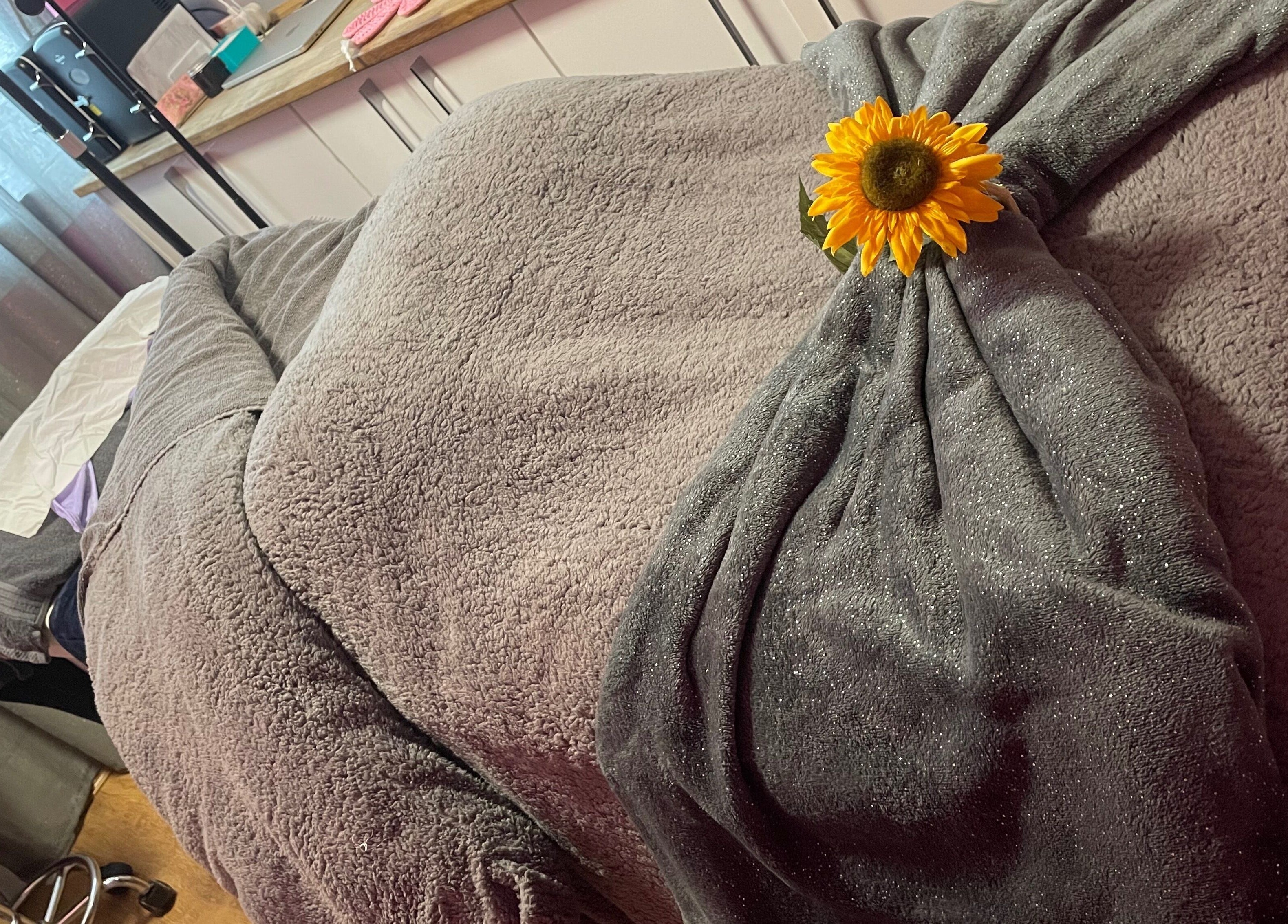 Relaxing massage bed with sunflower accent at A Little Unorthodox, Allesley Coventry, England, GB.