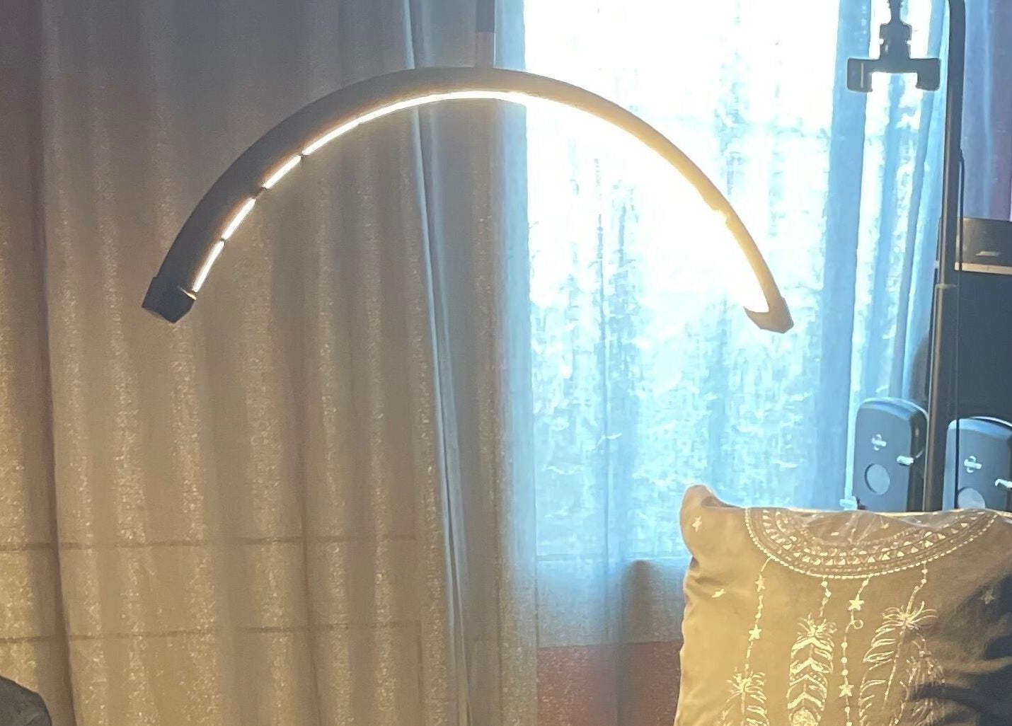 Cozy corner at A Little Unorthodox, Allesley Coventry, England, GB featuring a glowing lamp and decorative pillow.