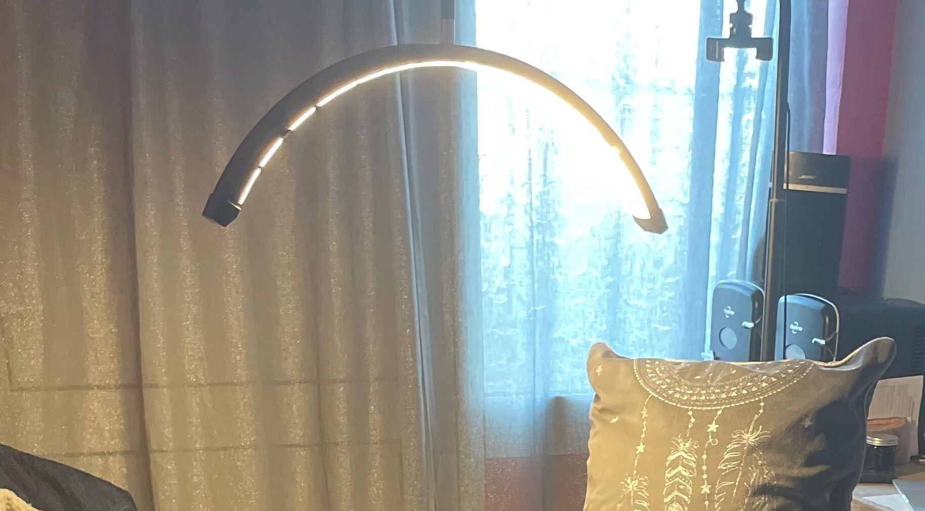 Cozy corner at A Little Unorthodox, Allesley Coventry, England, GB featuring a glowing lamp and decorative pillow.