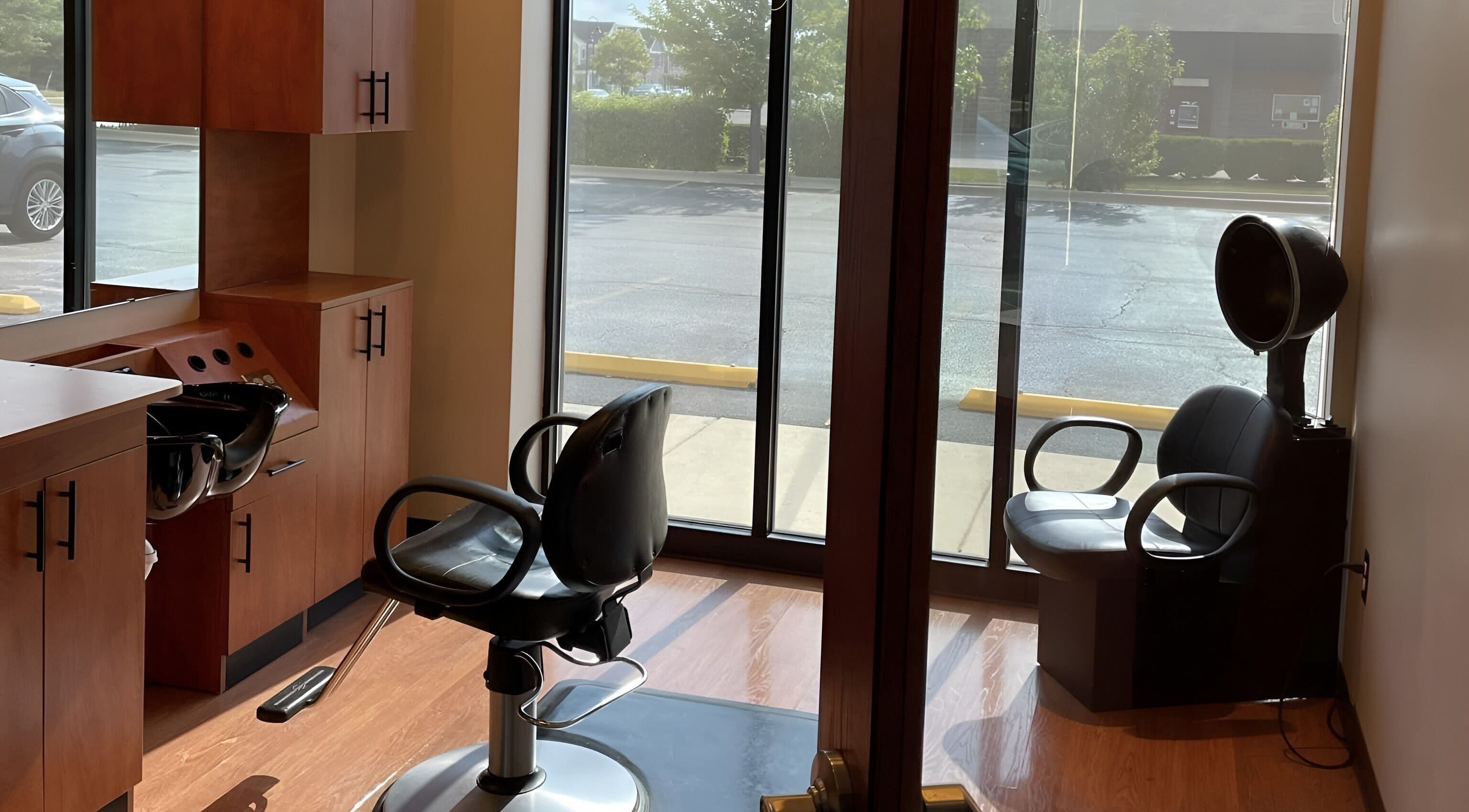 Cozy salon seating at Meghan Quinn Hair Design, Batavia, Illinois, US, with modern hair styling equipment.