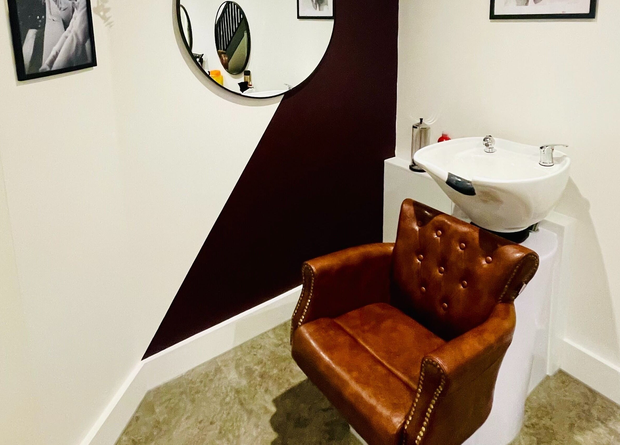 Luxurious barber chair and sink at Copper Row Barbers, London, England, GB, showcasing modern elegance.