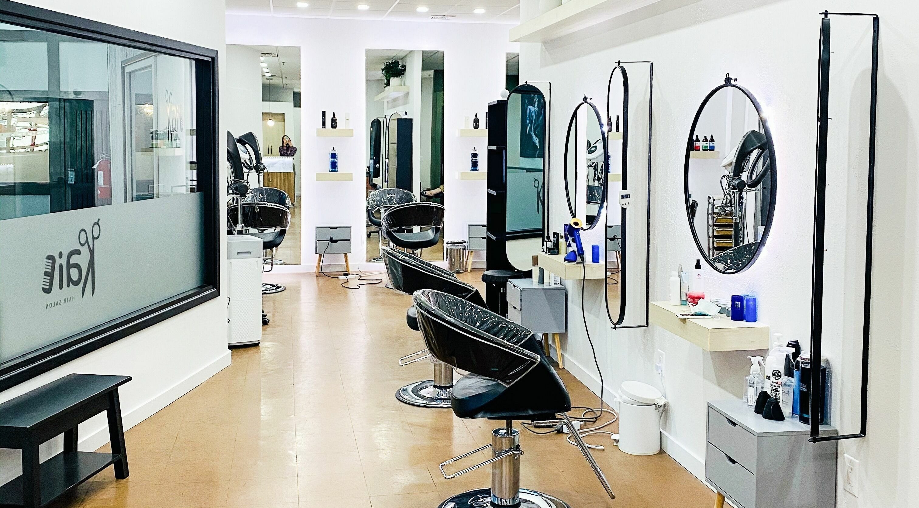 Modern interior of Kaie Salon in Fort Lee, New Jersey, US, featuring stylish hair stations and mirrors.