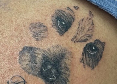 Detailed paw tattoo crafted at Fineline Tattoos By Carla in Melbourne, Victoria, AU, showcasing artistic flair.