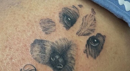 Detailed paw tattoo crafted at Fineline Tattoos By Carla in Melbourne, Victoria, AU, showcasing artistic flair.