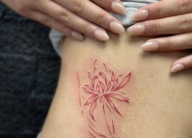 Elegant floral tattoo at Fineline Tattoos By Carla, Melbourne, Victoria, AU. Intricate design on skin.