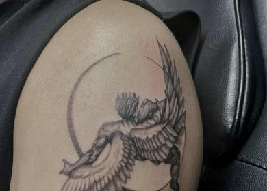 Intricate wing tattoo on arm at Fineline Tattoos By Carla, Melbourne, Victoria, AU.