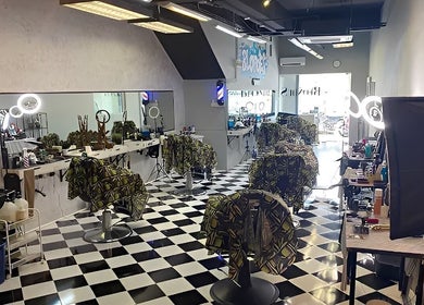 Modern interior of Blondes The Barbershop in Petaling Jaya, Selangor, MY with checkered floors and styling chairs.