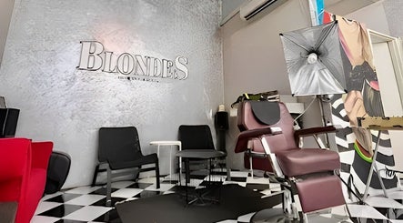Interior of Blondes The Barbershop in Petaling Jaya, Selangor, MY, featuring stylish chairs and modern decor.