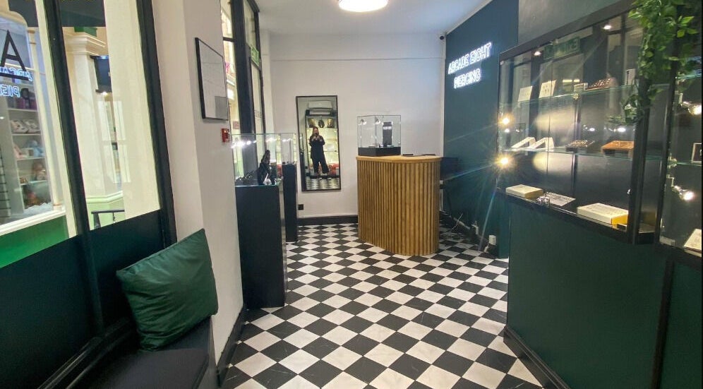 Stylish interior of Arcade Eight Piercing at Newport Pagnell, England, GB, showcasing elegant design and ambiance.