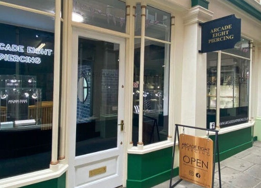 Arcade Eight Piercing exterior in Newport Pagnell, England, GB showcasing a modern, welcoming design.