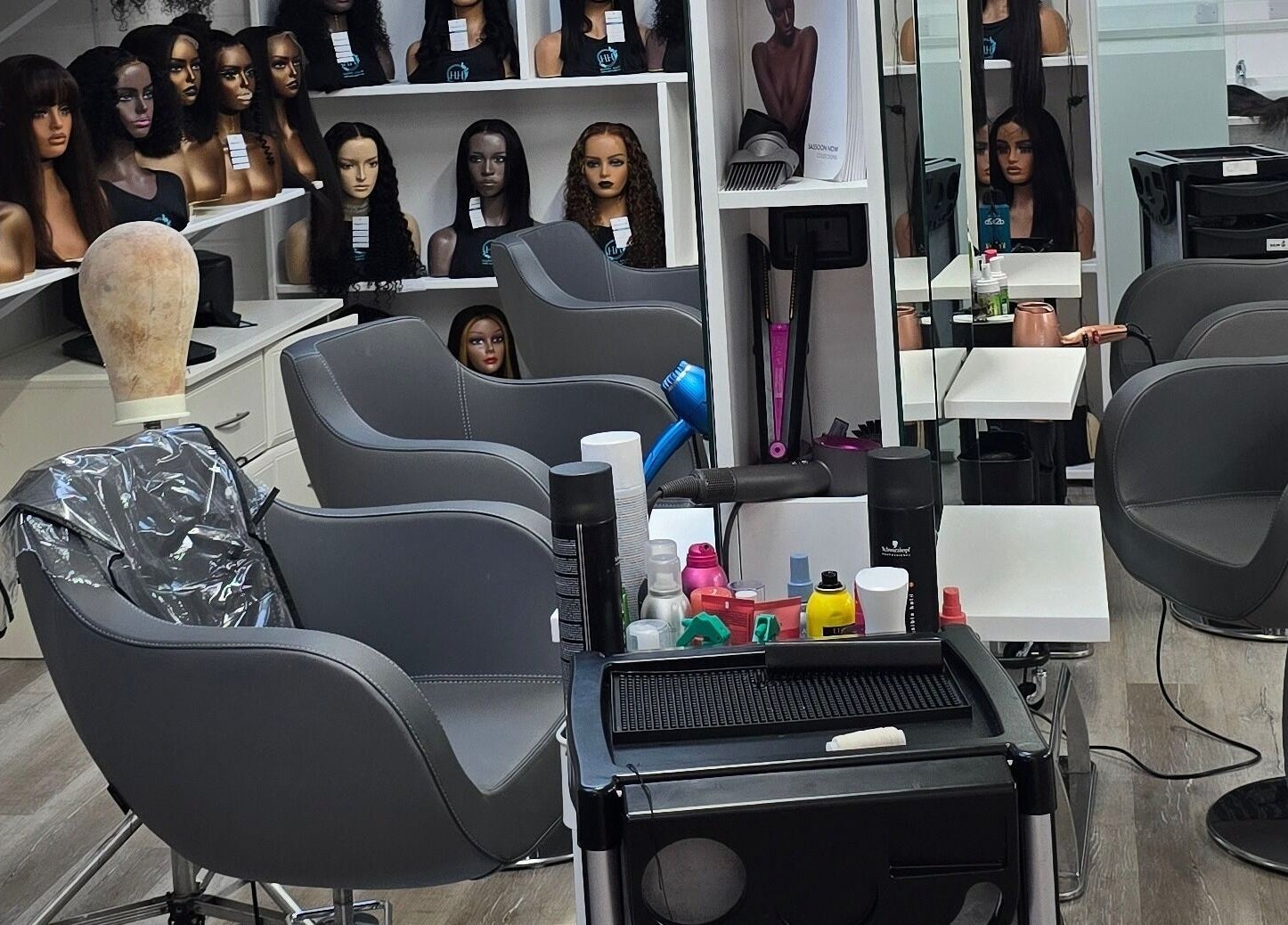 Modern salon chairs and hair products at Happy Hair - UK in Abbots Langley, England, GB.