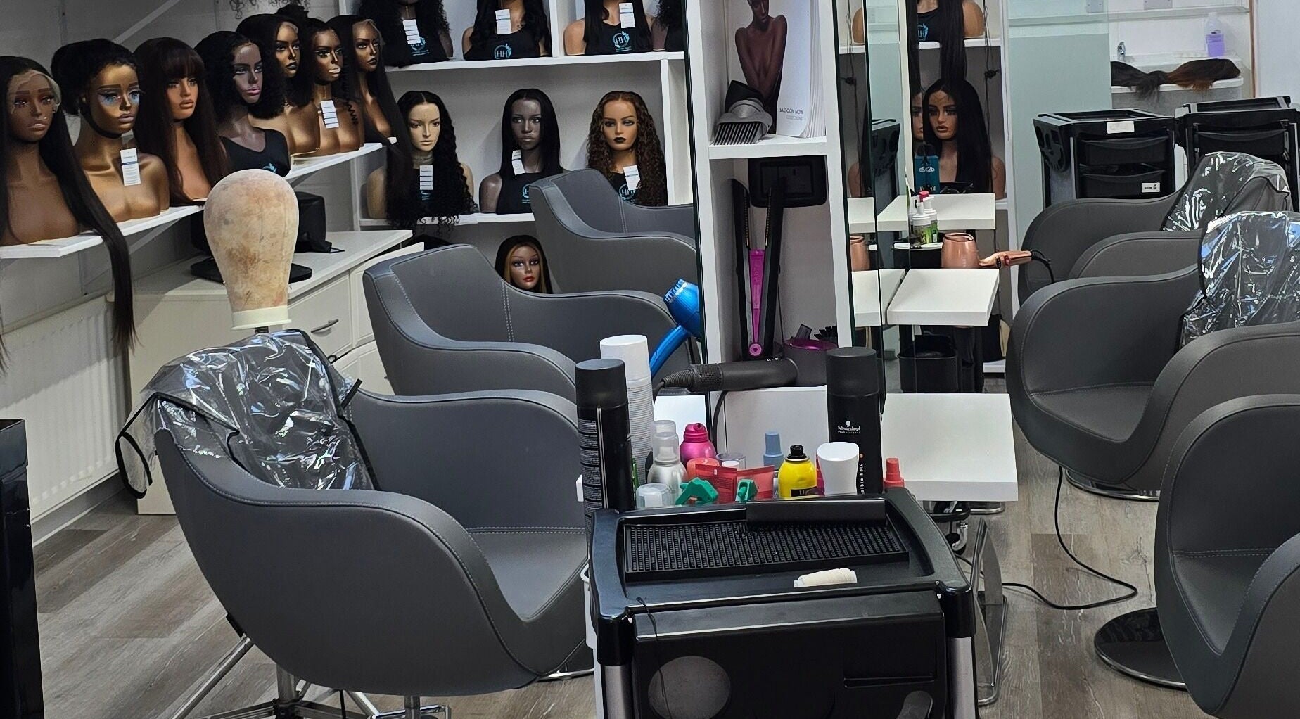 Modern salon chairs and hair products at Happy Hair - UK in Abbots Langley, England, GB.