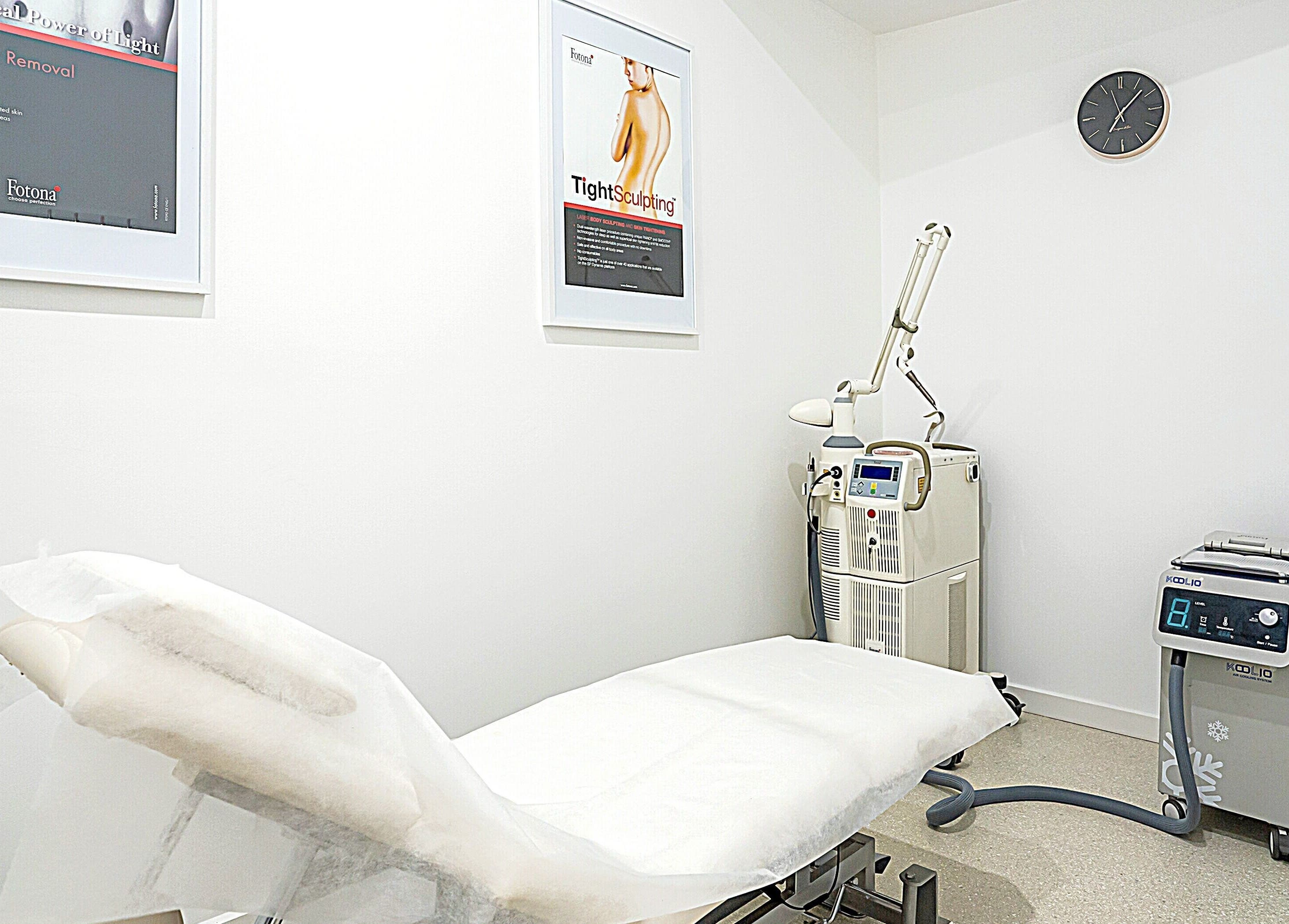 Hydra Skin Bar treatment room in Melbourne, Victoria, AU featuring modern equipment and a comfortable bed.