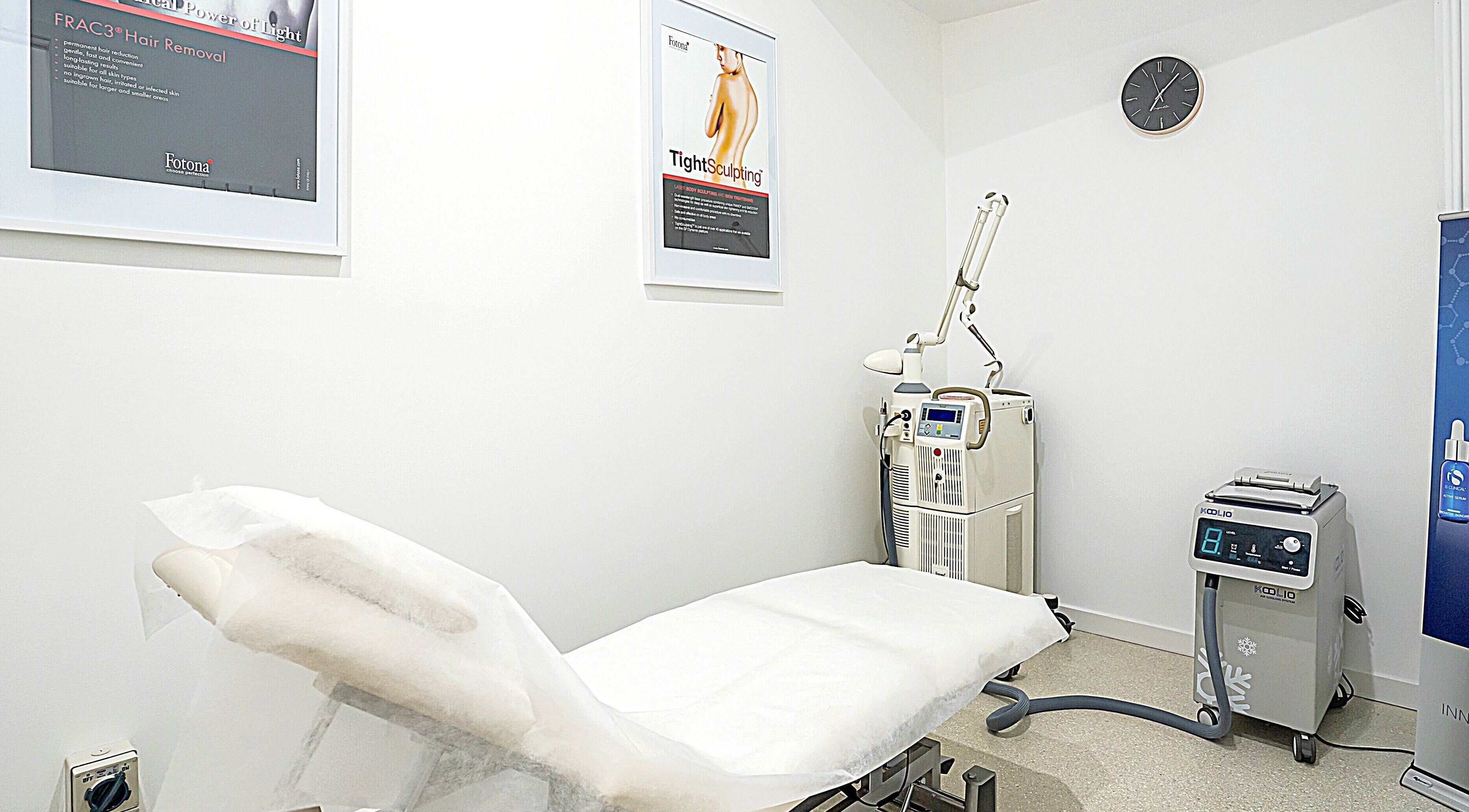 Hydra Skin Bar treatment room in Melbourne, Victoria, AU featuring modern equipment and a comfortable bed.