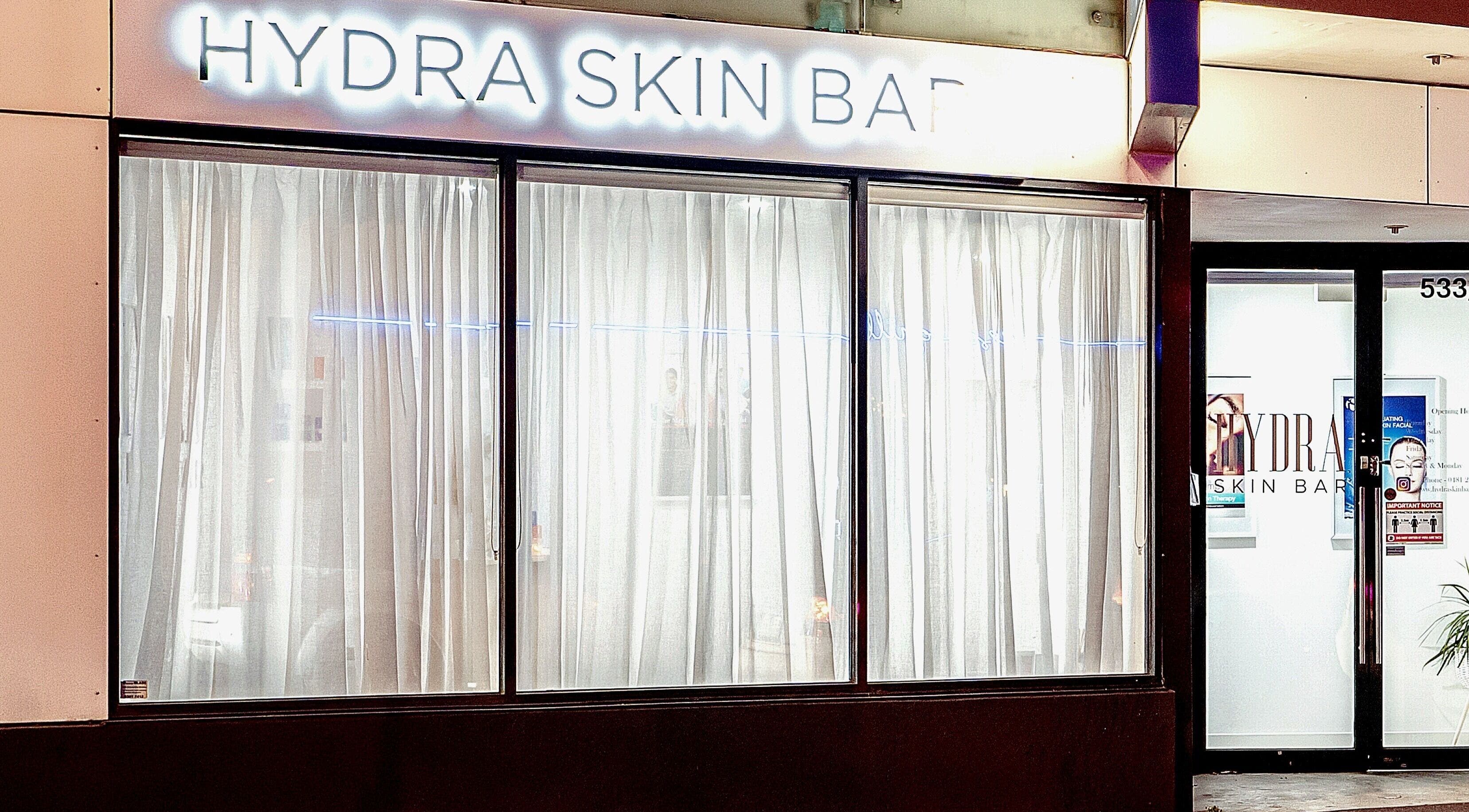 Front view of Hydra Skin Bar, Melbourne, Victoria, AU showcasing elegant windows and inviting entrance.