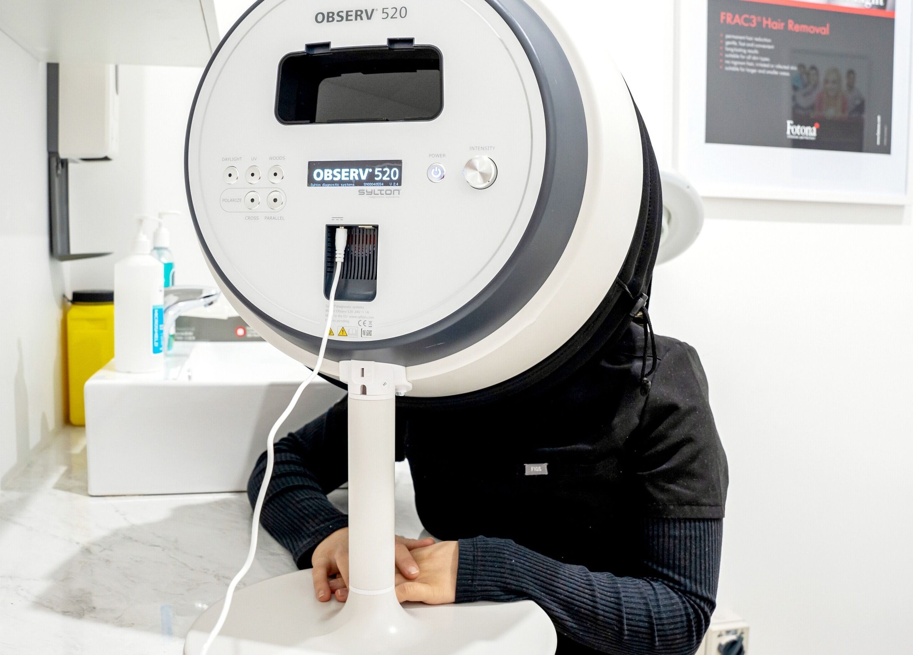 Client using dermascope at Hydra Skin Bar, Melbourne, Victoria, AU for skin analysis.