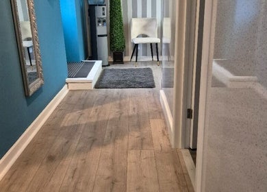 Modern hallway at Evesham Aesthetics Clinic Limited in Evesham, England, with elegant decor and flooring.