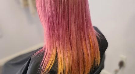 Bright pink and orange hair transformation at Taboo Salon, Telford, Pennsylvania, US, showcasing expert coloring.