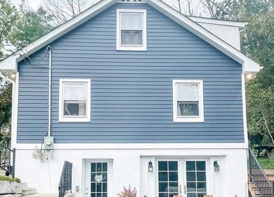 Charming exterior of Taboo Salon in Telford, Pennsylvania, US, featuring a stylish blue facade and welcoming stairs.