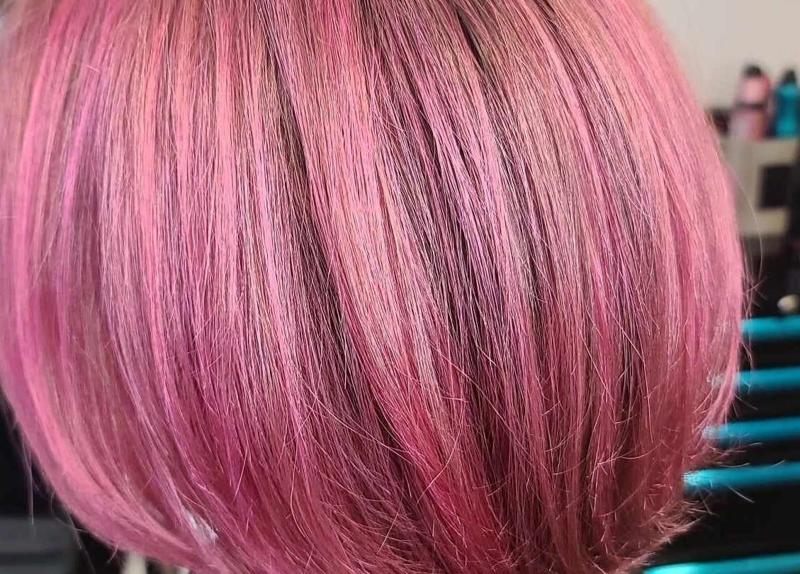 Vibrant pink bob haircut at Taboo Salon, Telford, Pennsylvania, US. Showcasing expert styling and color.