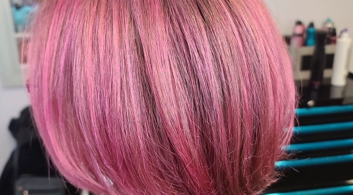 Vibrant pink bob haircut at Taboo Salon, Telford, Pennsylvania, US. Showcasing expert styling and color.
