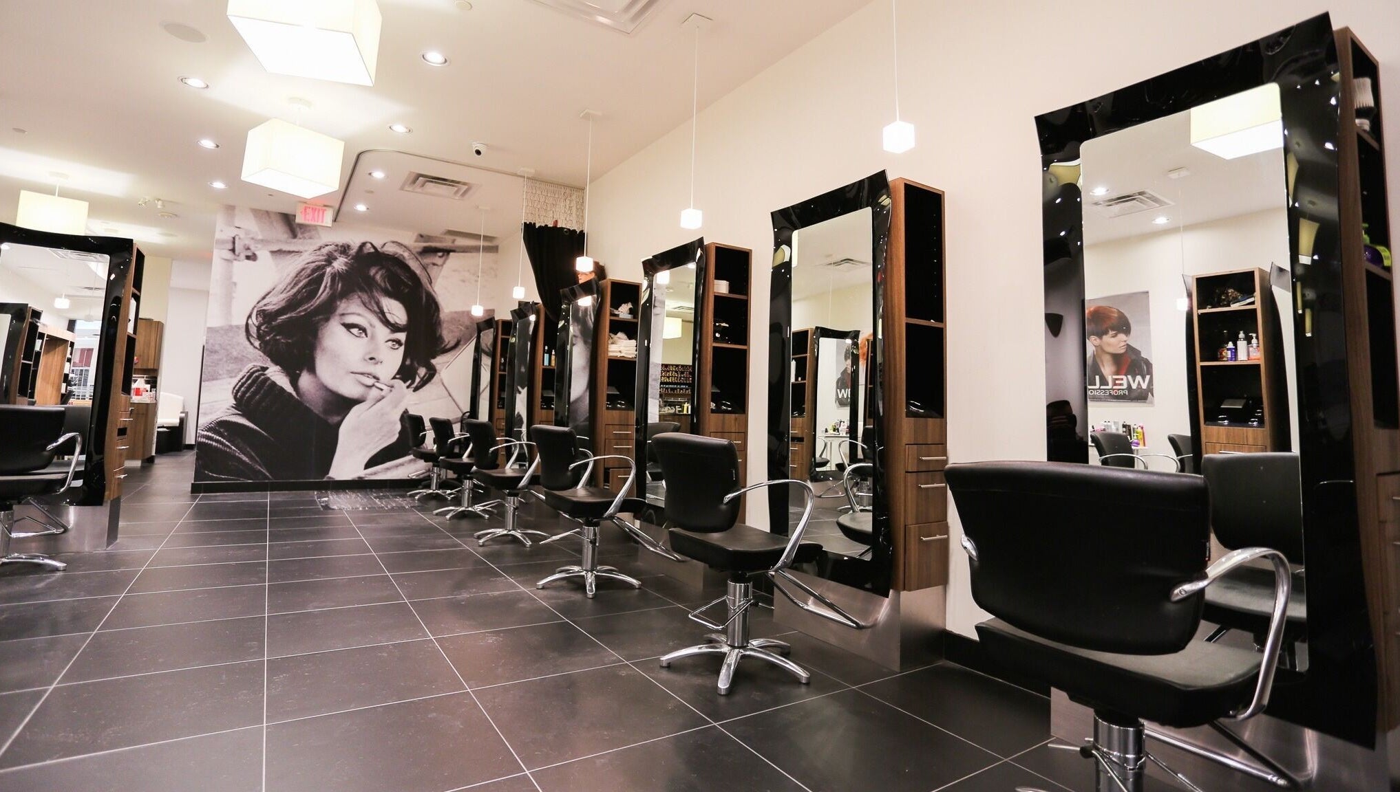 Modern salon at Joseph's Coiffures with sleek chairs in Ottawa, Ontario, CA.