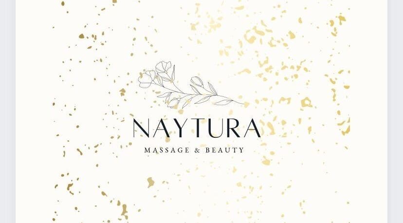 Naytura Massage and Beauty logo in Saint Helier, St Helier, JE with floral design and gold accents.