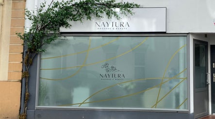 Front view of Naytura Massage and Beauty at Saint Helier, St Helier, JE with green signage.