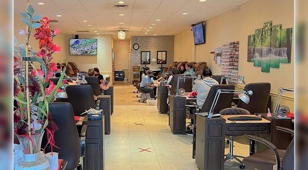 Customers relax at Harrison Nails in Harrison, Ohio, US, enjoying luxurious nail treatments in a serene setting.